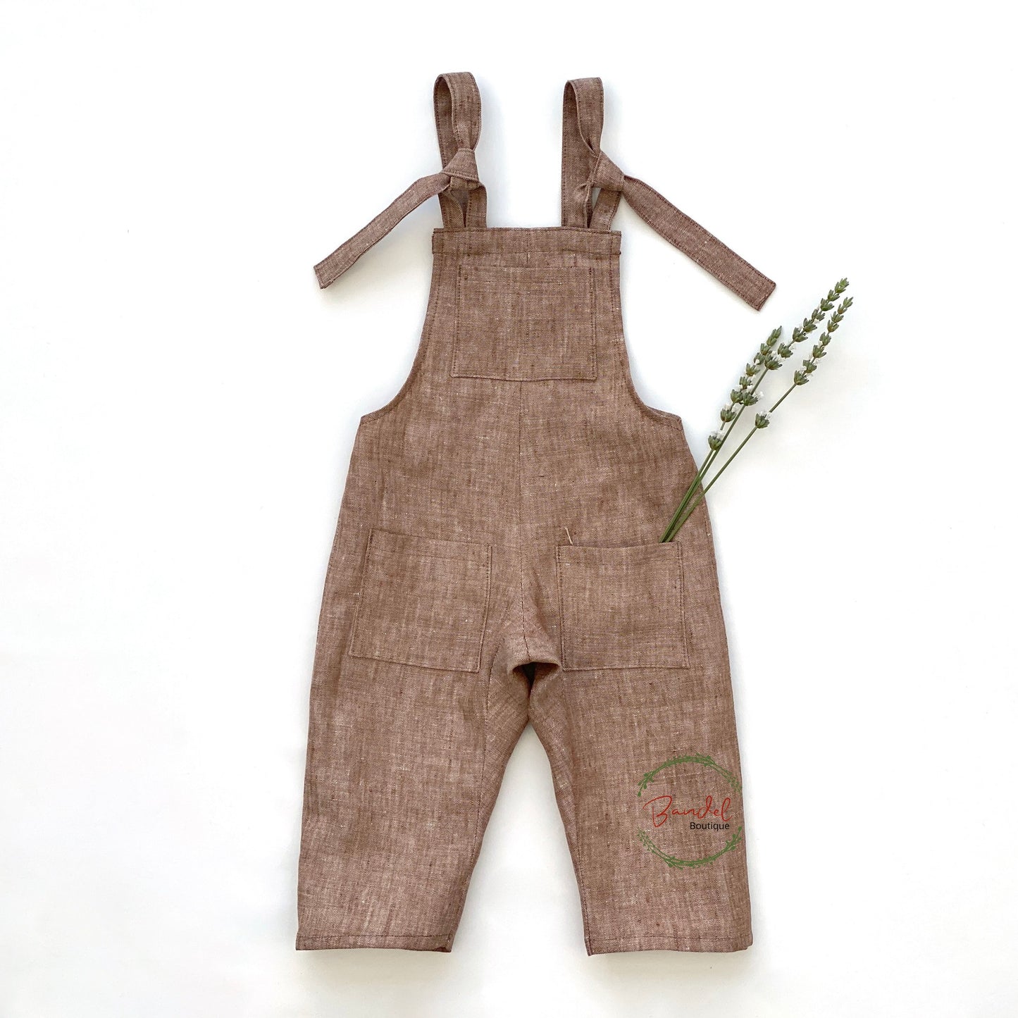 Brown Linen Dungarees are crafted from pure linen fabric to create a comfortable and sustainable pieace for your little one. The adjustable tie straps and three front pockets complete the relaxed fit for a versatile wardrobe essential.