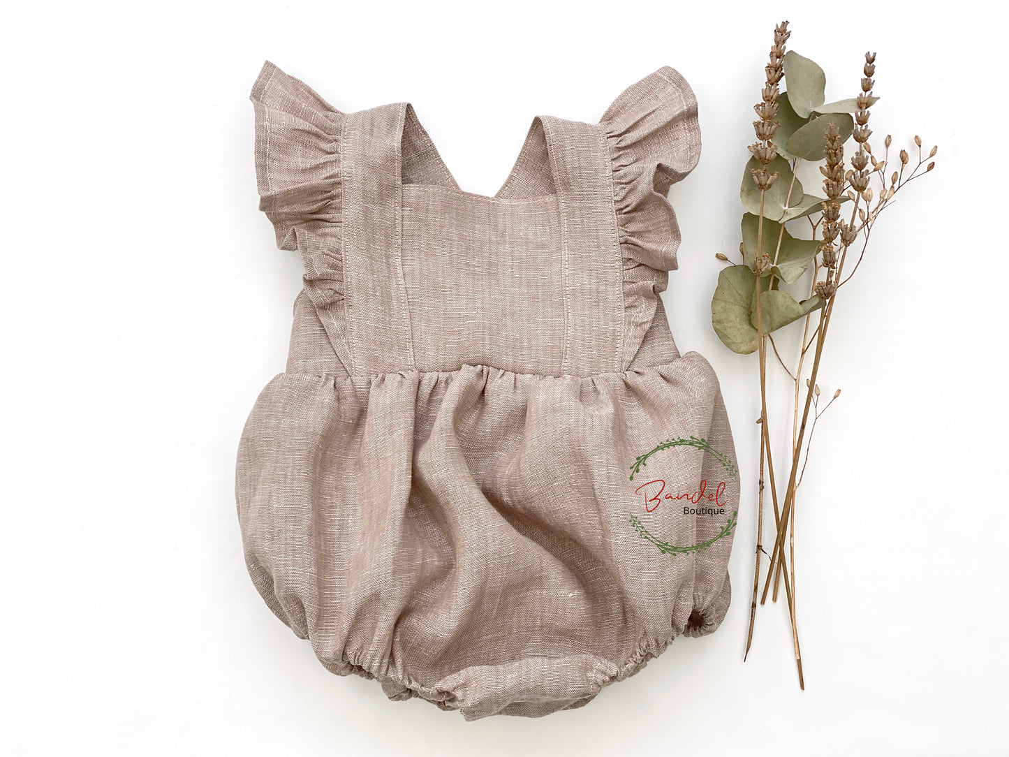 linen bubble romper is delightfully delicate and elegant. Crafted from sustainable and comfortable linen, this vintage bubble playsuit in a beautiful camel hue features ruffled sleeves, elastic at the leg and two adjustable button straps for easy growth adjustments. With snaps at the crotch for convenient diaper changes, this romper is sure to be your little one's favorite look.