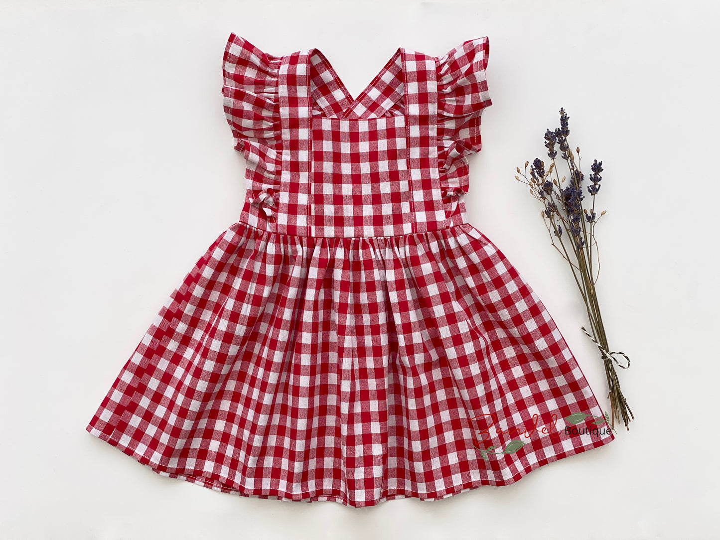 Classic Red Gingham Vintage Dress for girls features adjustable straps, ruffled sleeves, and a full gathered skirt for a timeless look.
