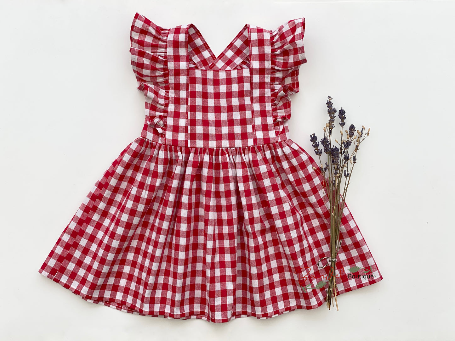 Classic Red Gingham Vintage Dress for girls features adjustable straps, ruffled sleeves, and a full gathered skirt for a timeless look.