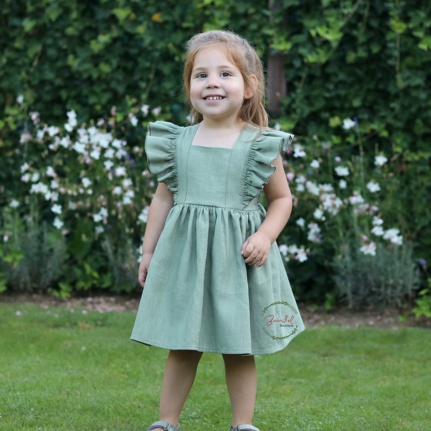 Timeless charm with our exquisite dark- mint linen dress for girls. Crafted from high-quality linen fabric in The Netherlands. This vintage-inspired dress features sleeve ruffles, adjustable straps, and a gathered skirt. The lightweight and breathable fabric ensure both comfort and sophistication. Perfect for weddings, birthdays, or family gatherings, this dress adds a touch of elegance to any special occasion. Available in various sizes. Create lasting memories in style with our dark- mint linen dress!